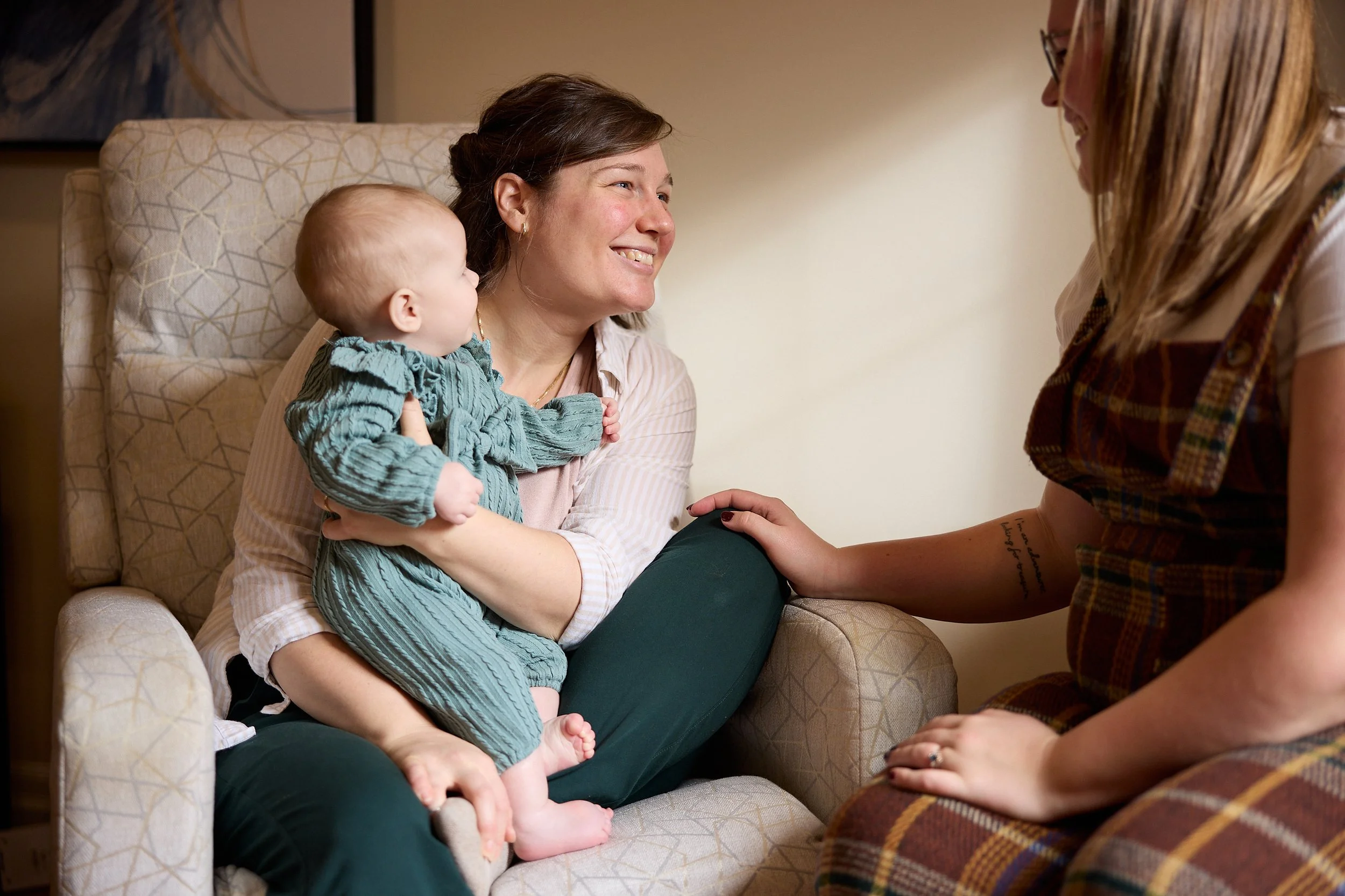 in home lactation consultant supporting a new mom and her baby learn to breastfeed in brantford ontario