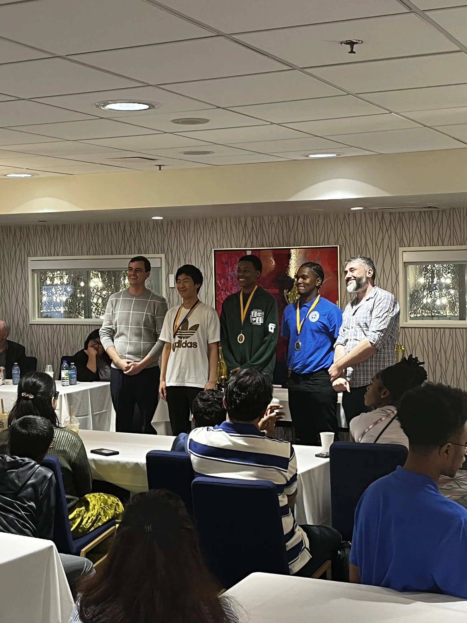 Toronto Chess Club organizers and medal-winning players at a youth tournament.