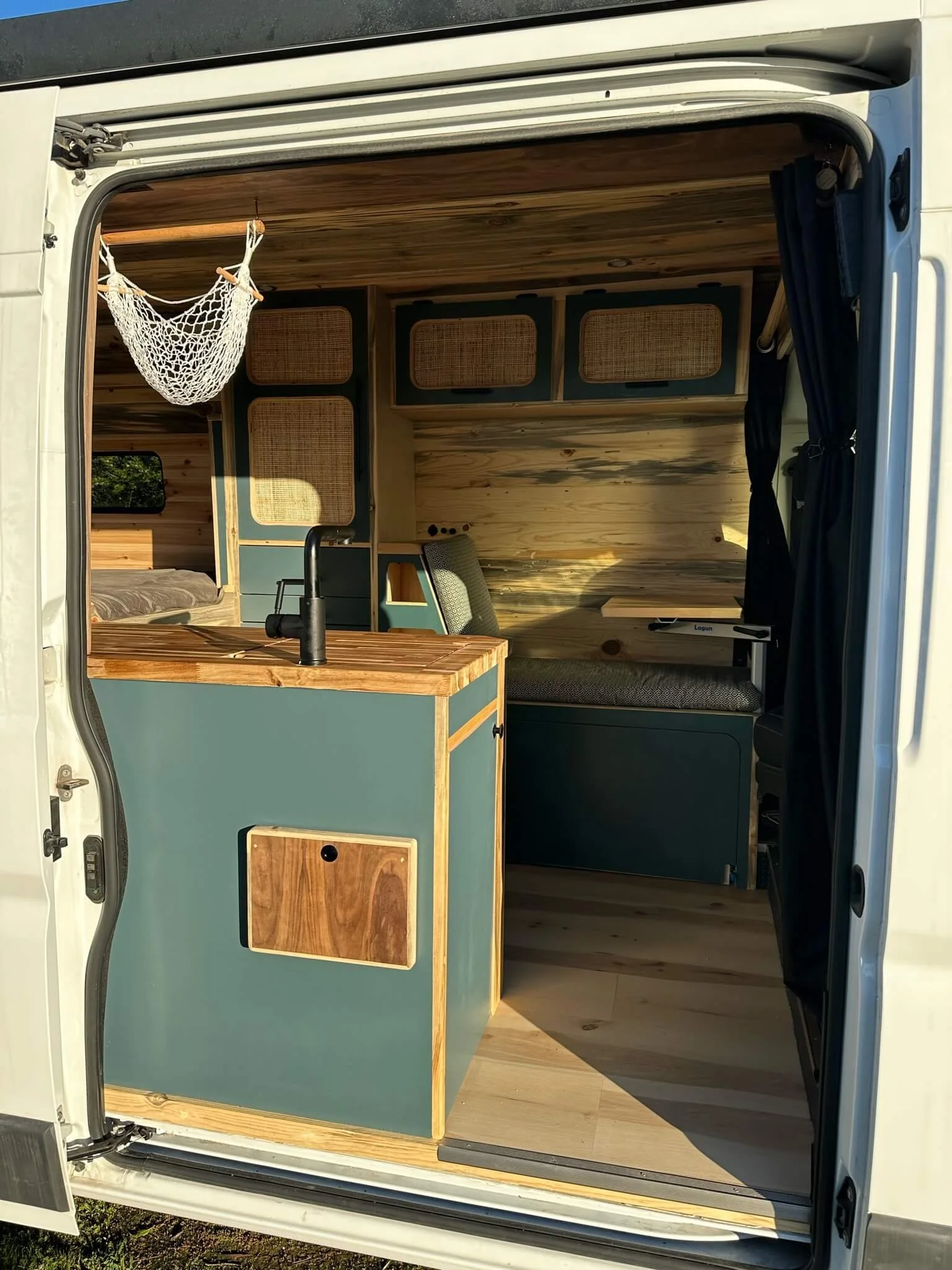 yolo-camper-vans-int-van-kitchen-sink-from-outside.JPG