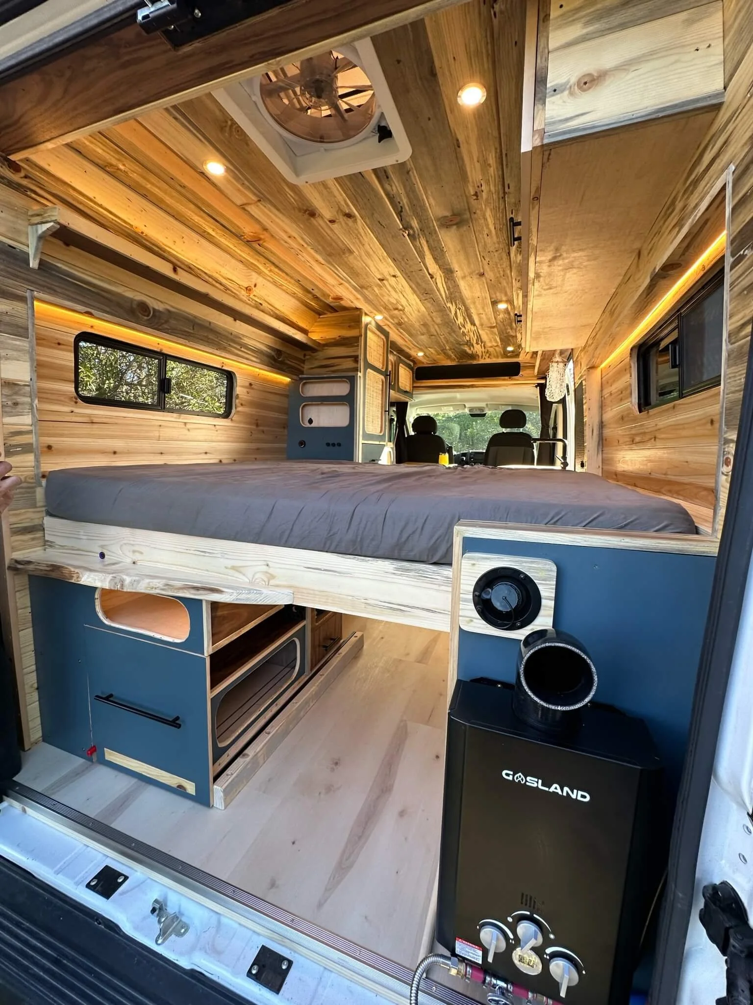 yolo-camper-vans-int-light-wood-bed.JPG