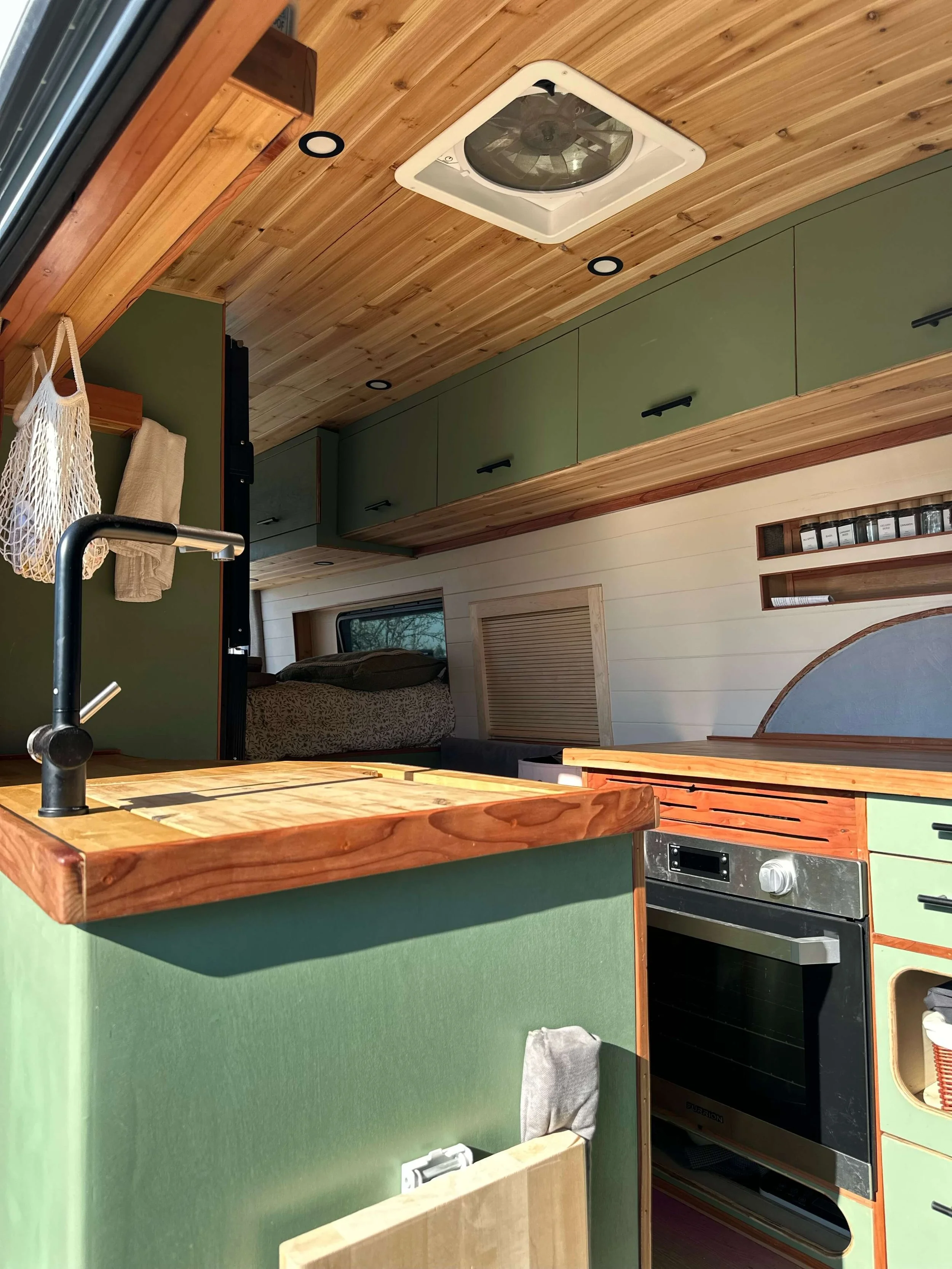 yolo-camper-vans-int-van-green-cabinets.JPEG
