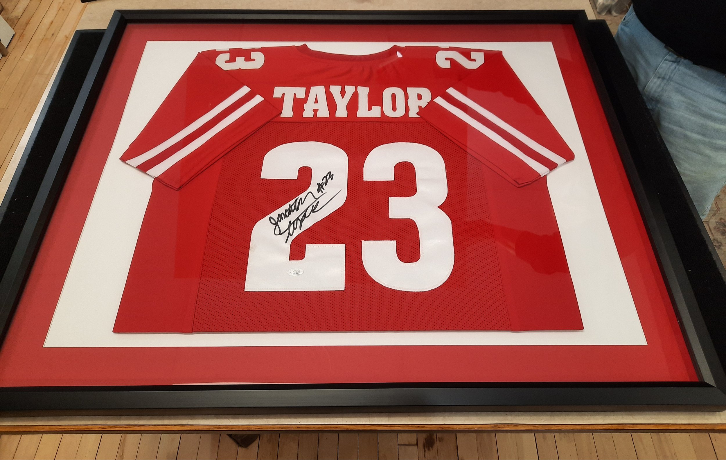 Signed sports Memorabilia framed. Double mat. Jonathan Taylor. Wisconsin Badgers jersey.