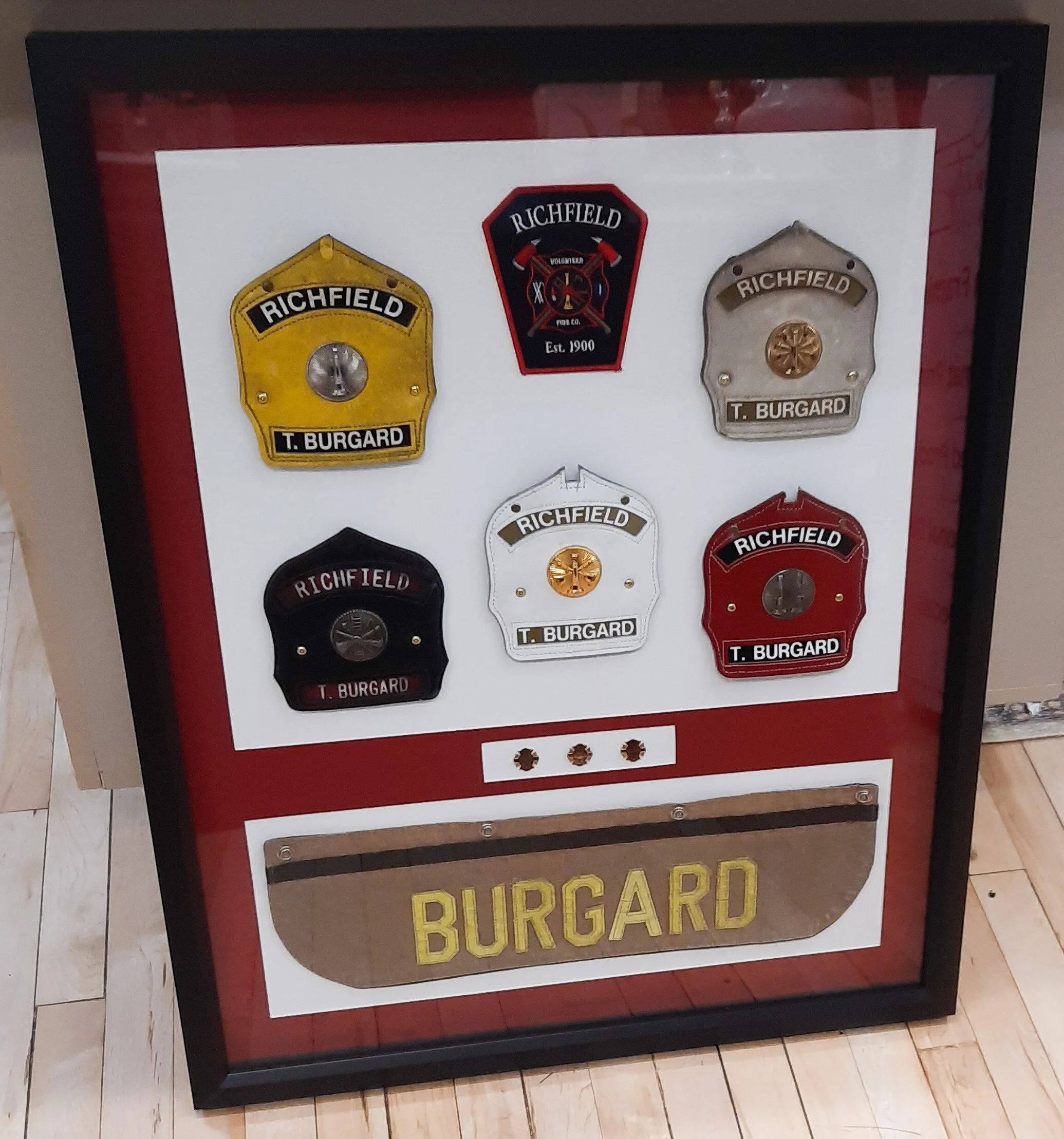 Fire chief, fireman, retirement shadowbox of badges, shields, and patches. Double mat