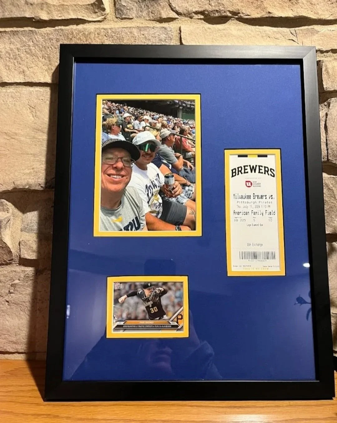 Sports Memorabilia. Milwaukee Brewers Ticket and photos in a frame with a double mat.