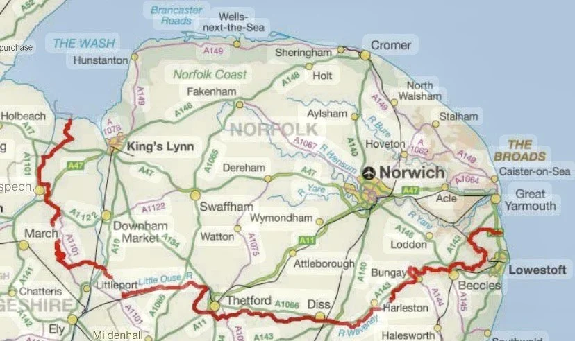 Map of Norfolk, England, highlighting the coast, roads, and towns, with a red trail marking a route along the southern coastline.