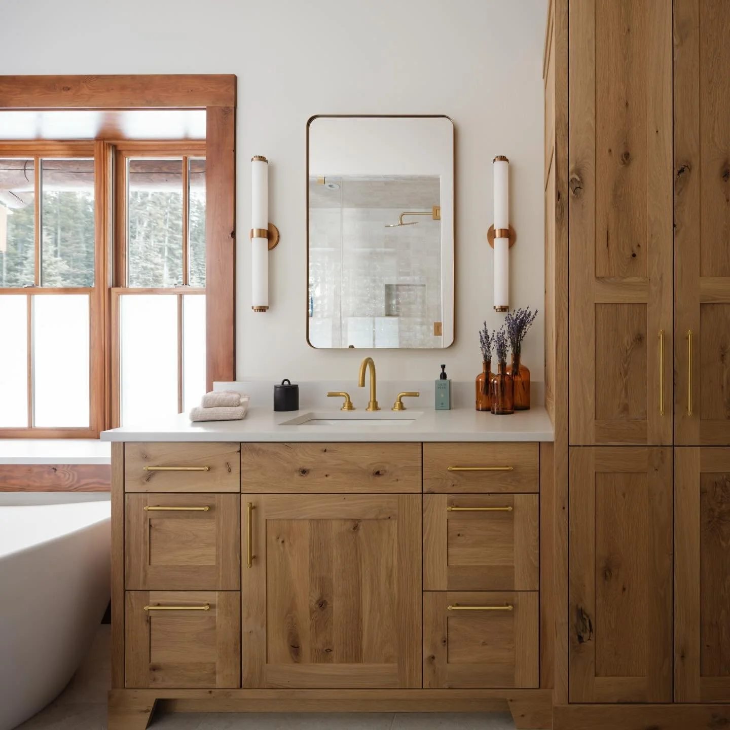 The gorgeous details and finishings of a mountain home in Moonlight. From white oak to clean tiles - this bathroom made this estate go from strictly rustic to rustic modern. 

#moonlightbasin #luxurycabins #montanaluxury