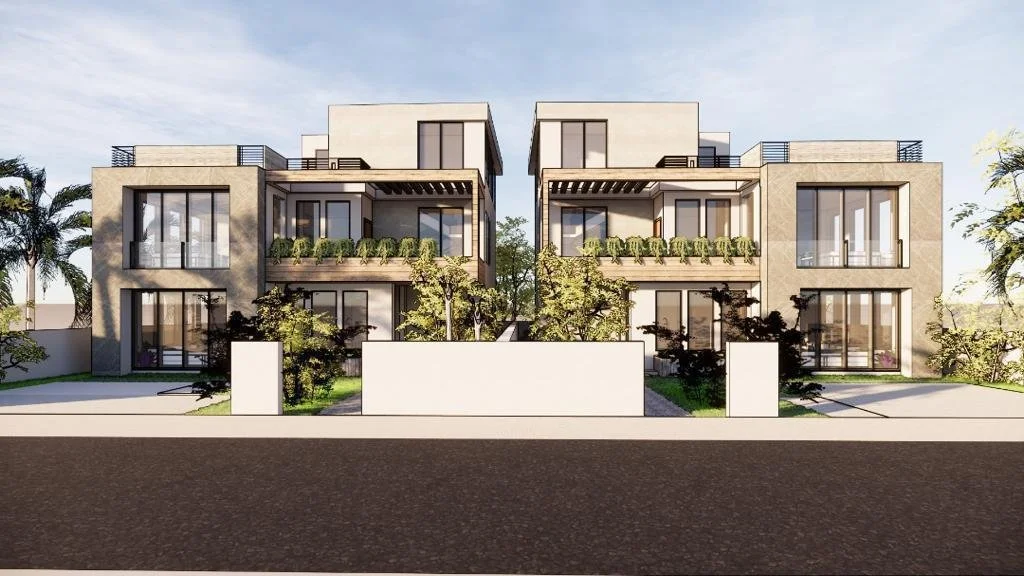 Modern multi-story residential building with large glass windows, balconies with greenery, and surrounding landscaped yard.