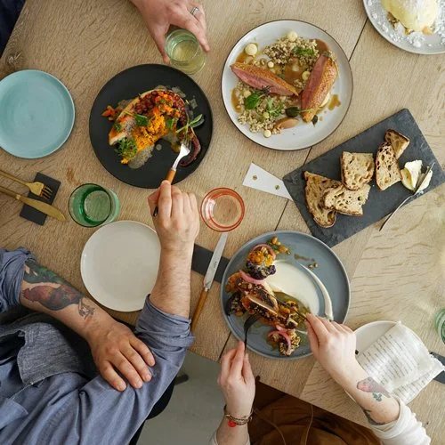an overhead view of guest eating brunch family style