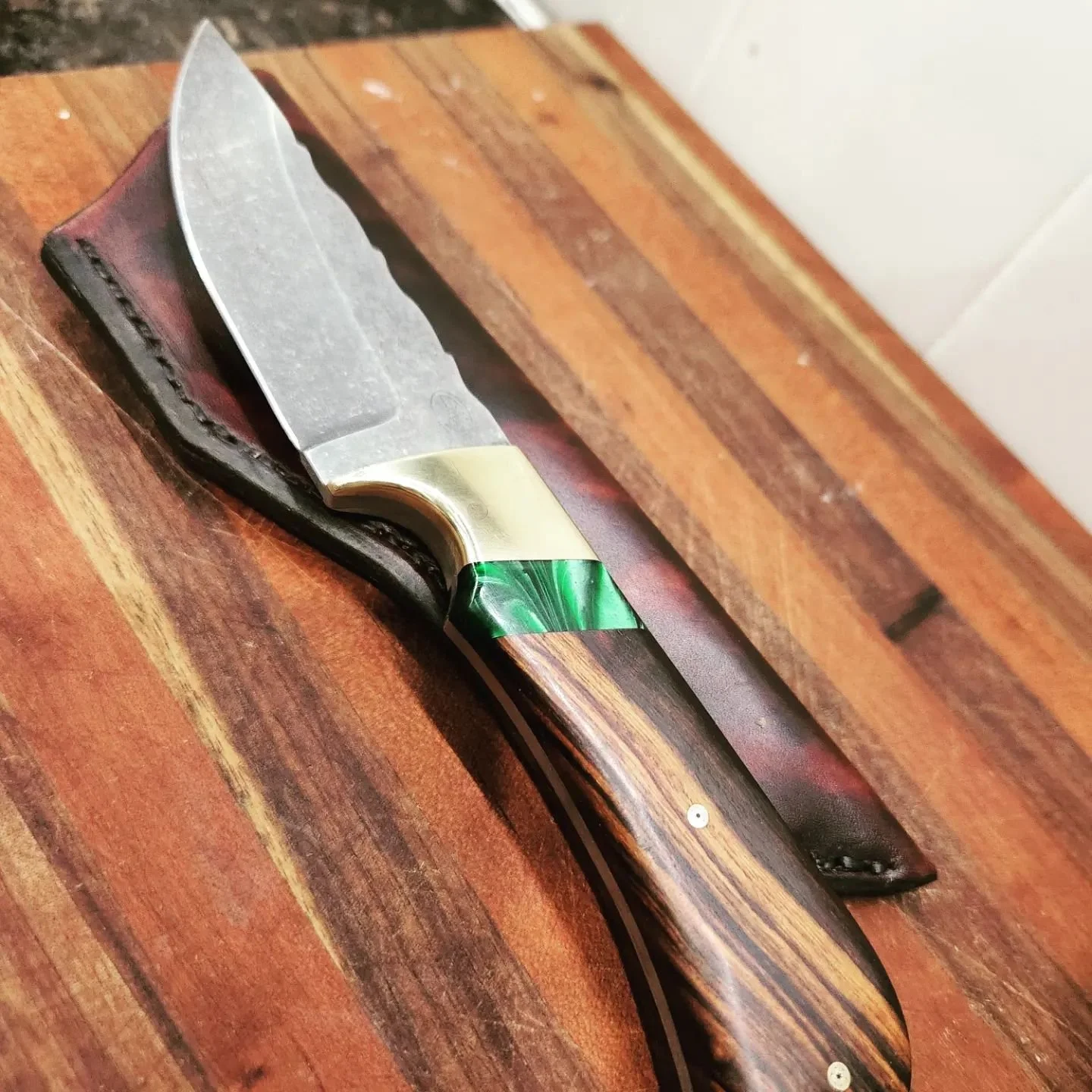 Copy of Dads knife I made for one of his friends. 1084 blade and ebony handle with an acrylic piece in there with a brass bolster.