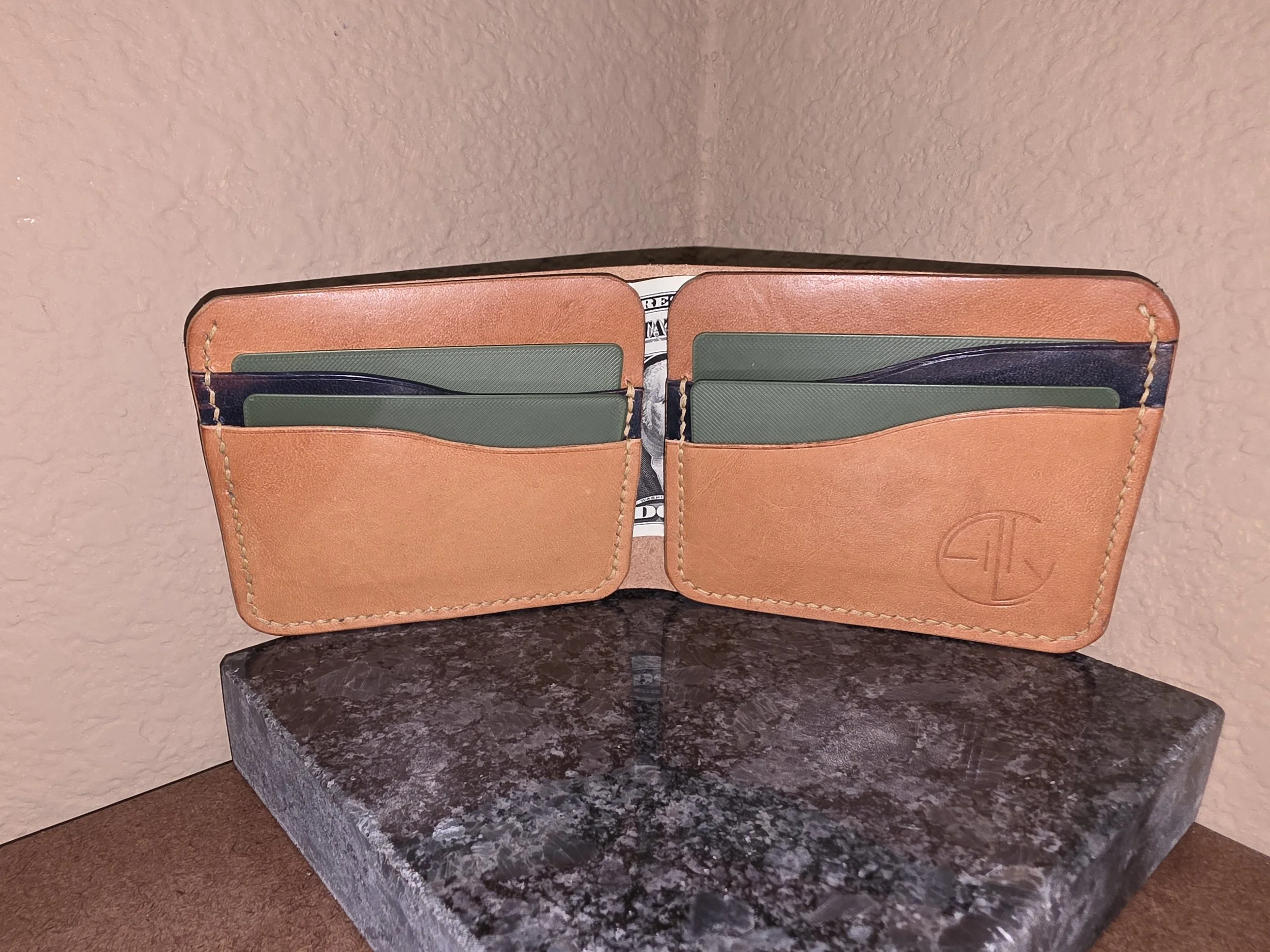 The money pouch is open so it takes that piece of leather out.