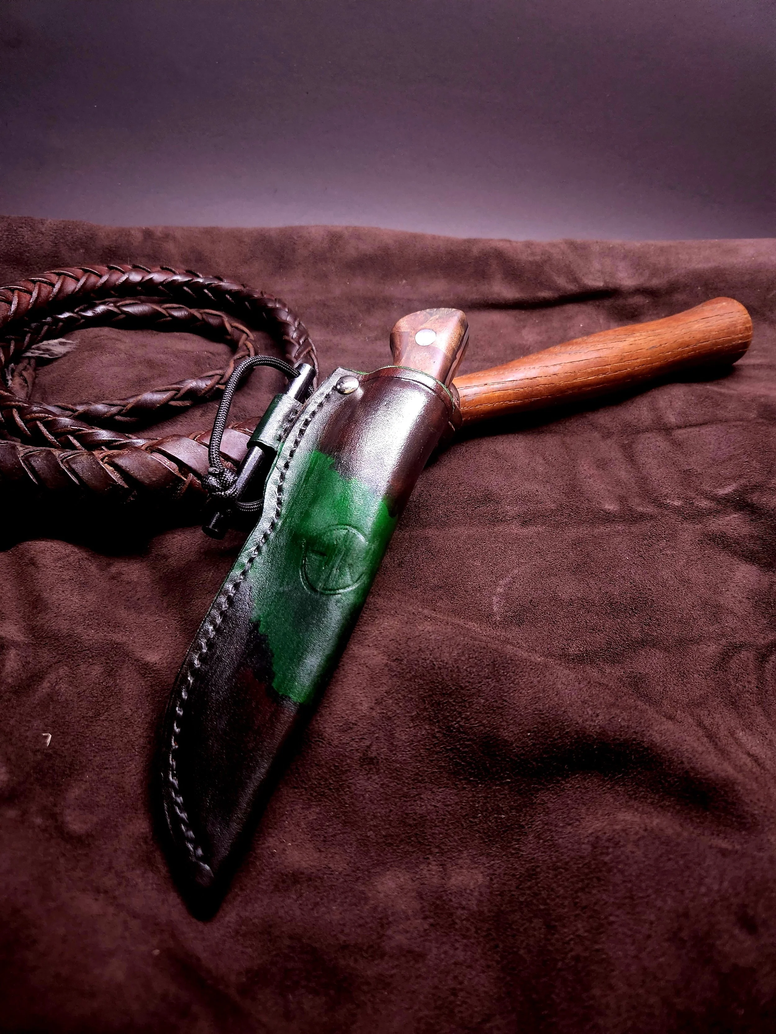 I tried to get fancy with the sheath here. It has a Ferro rod and holder on the side because he wanted it for camping.