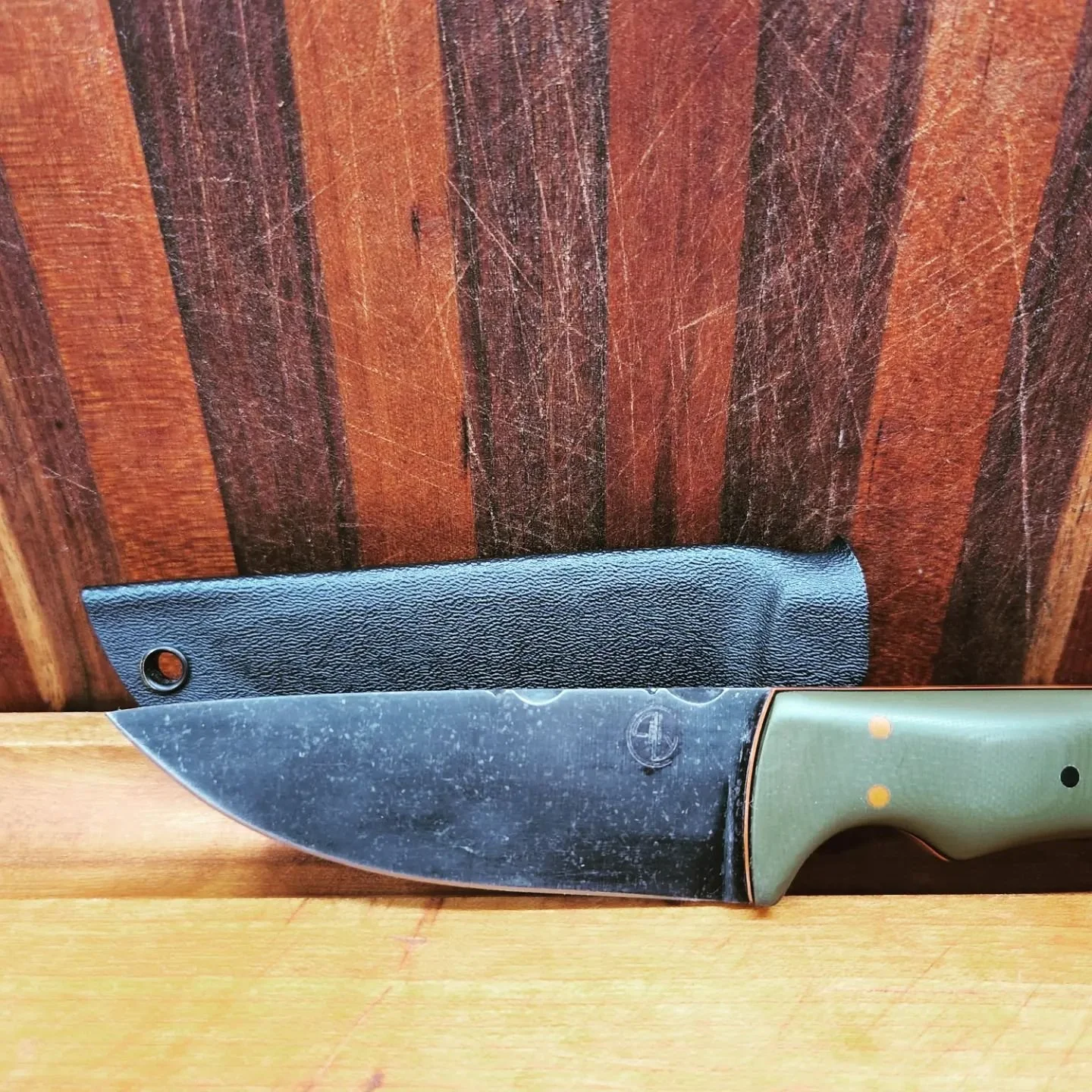 First copy of my dads knife. This was my second knife I made. 10 84 steel with G10 handle.