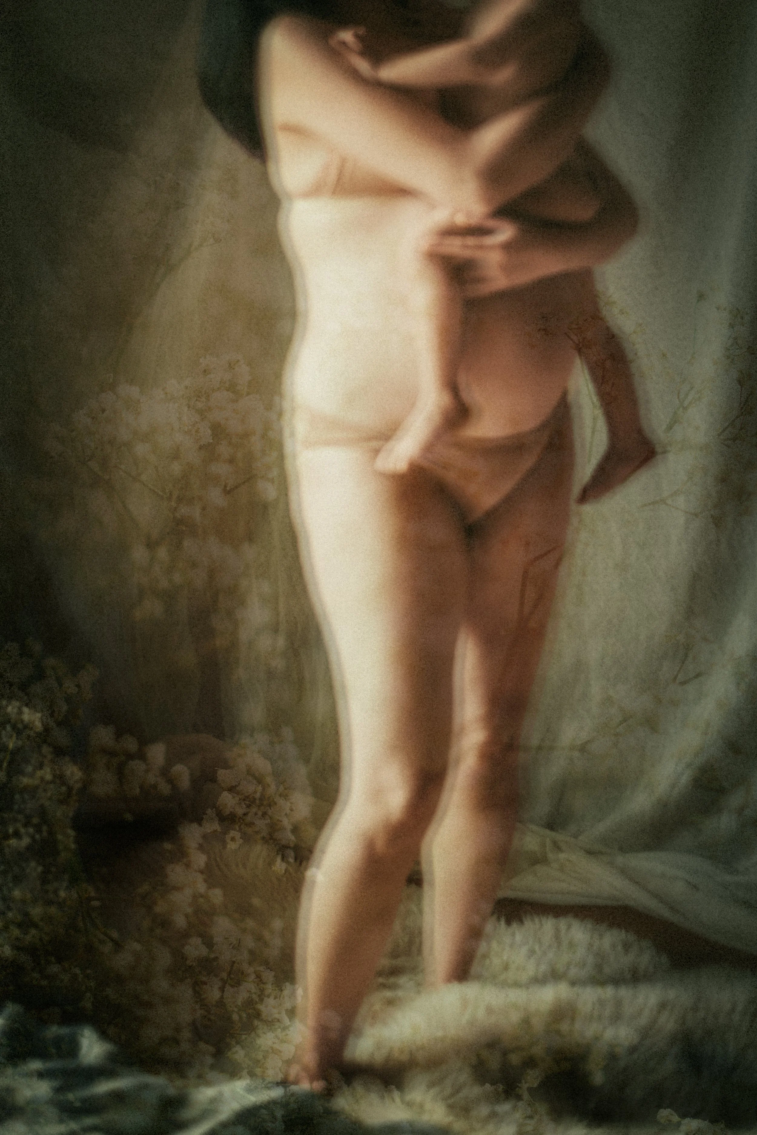 Abstract, painterly  of a pregnant mother in underwear and bra, holding her toddler on her belly, with flowers overlaid in double exposure and soft, warm light, capturing intimacy, emotion, and artistic expression