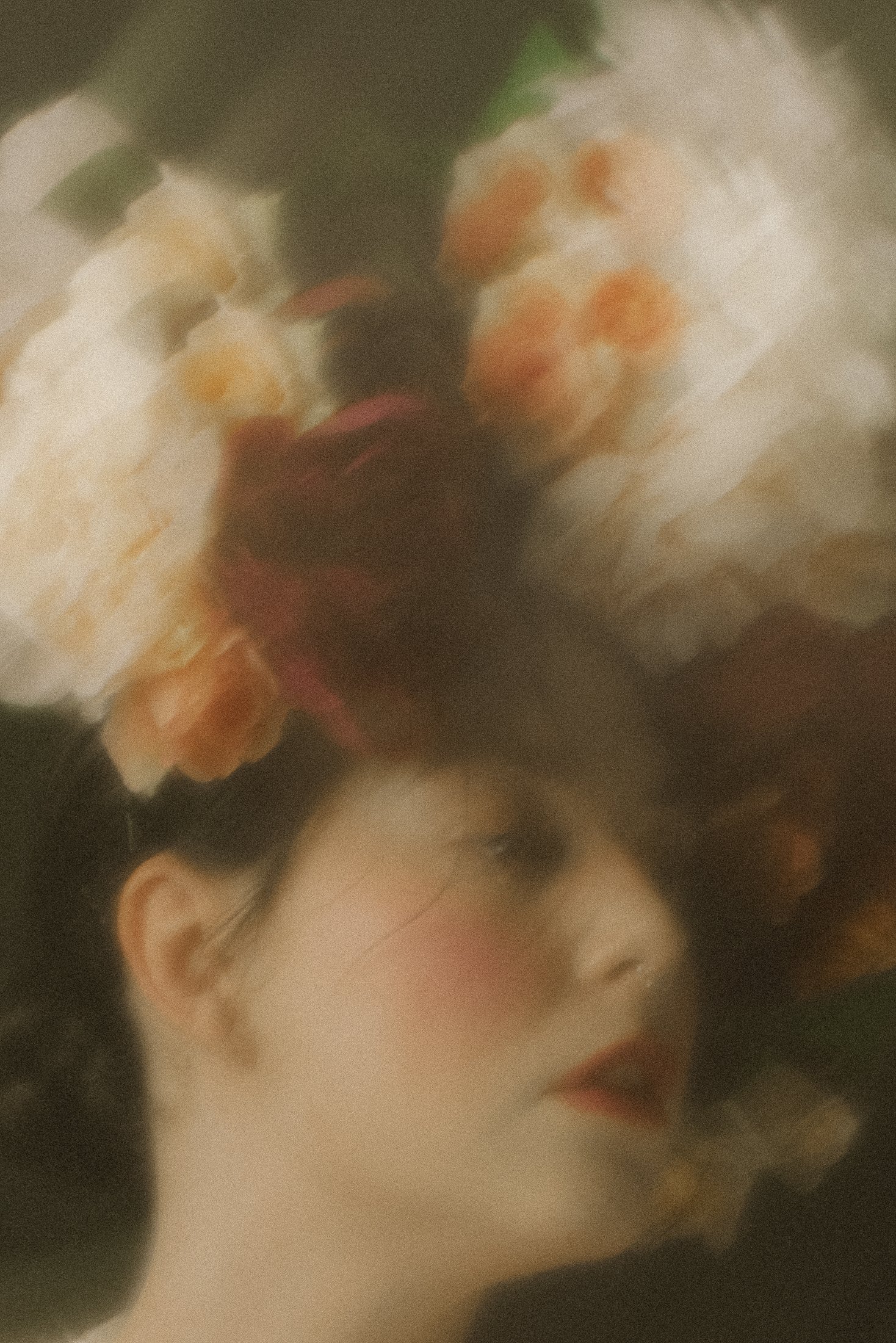 A woman with dark hair and makeup lying down with floral arrangements above her head, soft focus and warm lighting.
