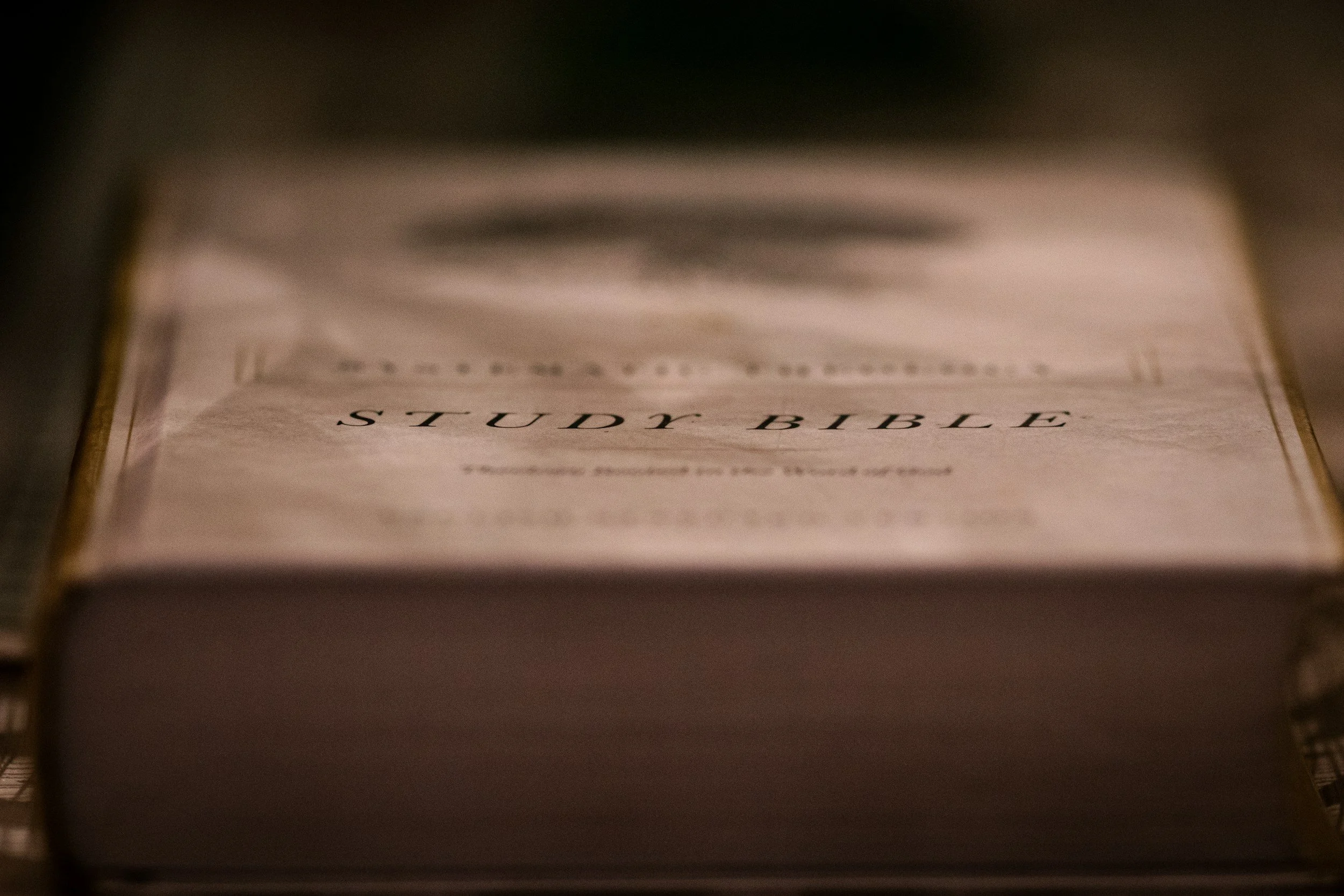 Close-up of a study Bible resting on a surface.
