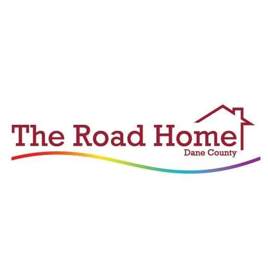 Logo for The Road Home, Dane County, featuring a house outline and a rainbow-colored arc.