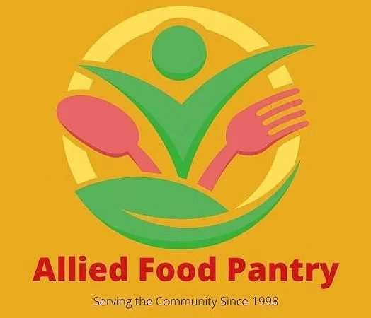 Logo for Allied Food Pantry showing a green person with outstretched arms, holding a pink spoon and fork, with a green bowl underneath, and text reading "Allied Food Pantry" and "Serving the Community Since 1998."