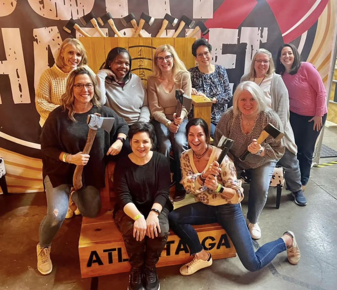 Widows Who Wine members holding axes