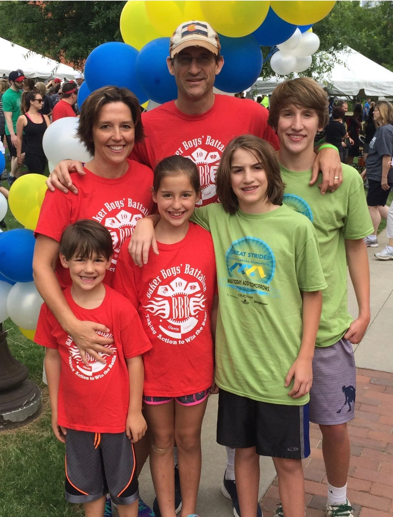 Pam Baker standing with family