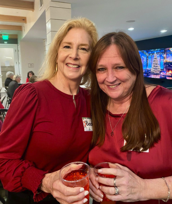 Widows Who Wine members standing with drinks