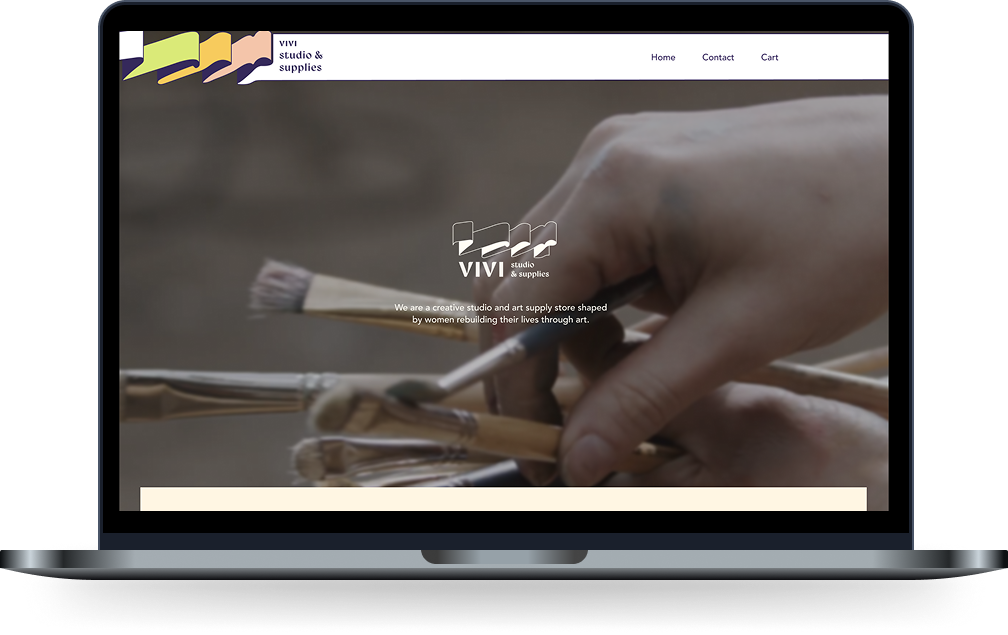A laptop screen displaying the homepage of VIVI Studio & Supplies, featuring a close-up image of a hand holding several paintbrushes, designed by Anastasiya Kim