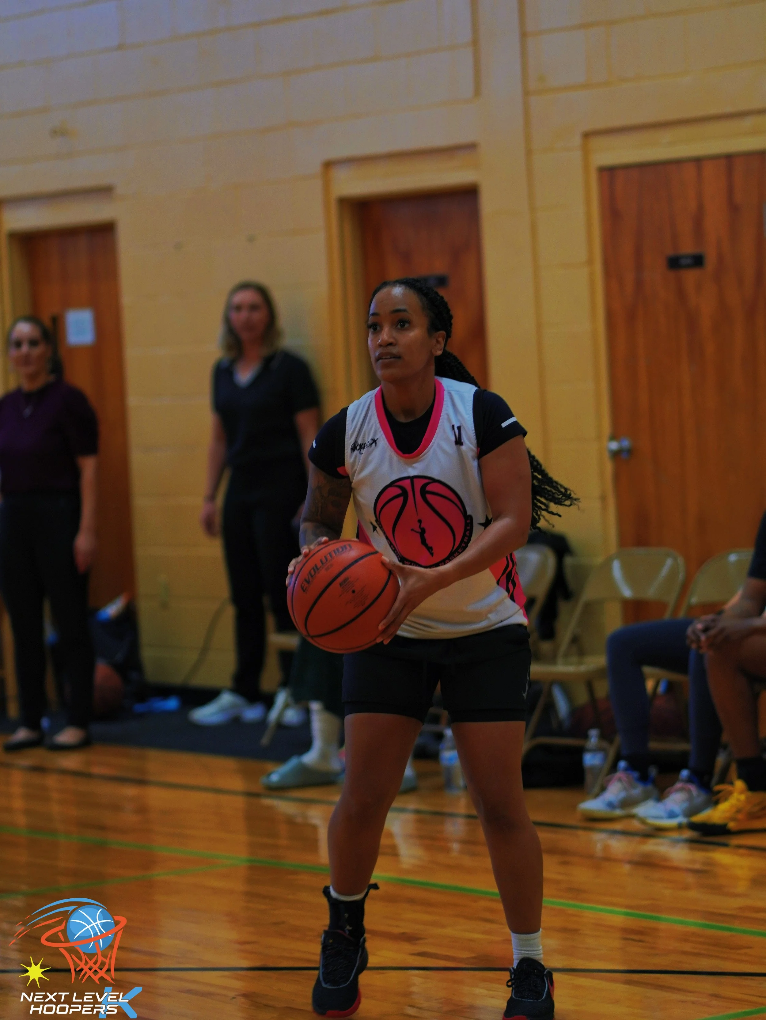 N'Kayah Kersey competing in a basketball game demonstrating leadership, discipline, and athletic performance.