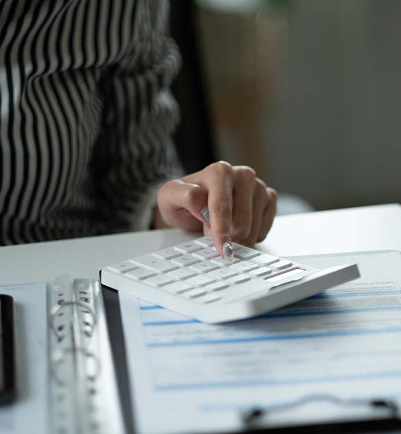 woman holding calculator doing tax preparation in bremerton washington