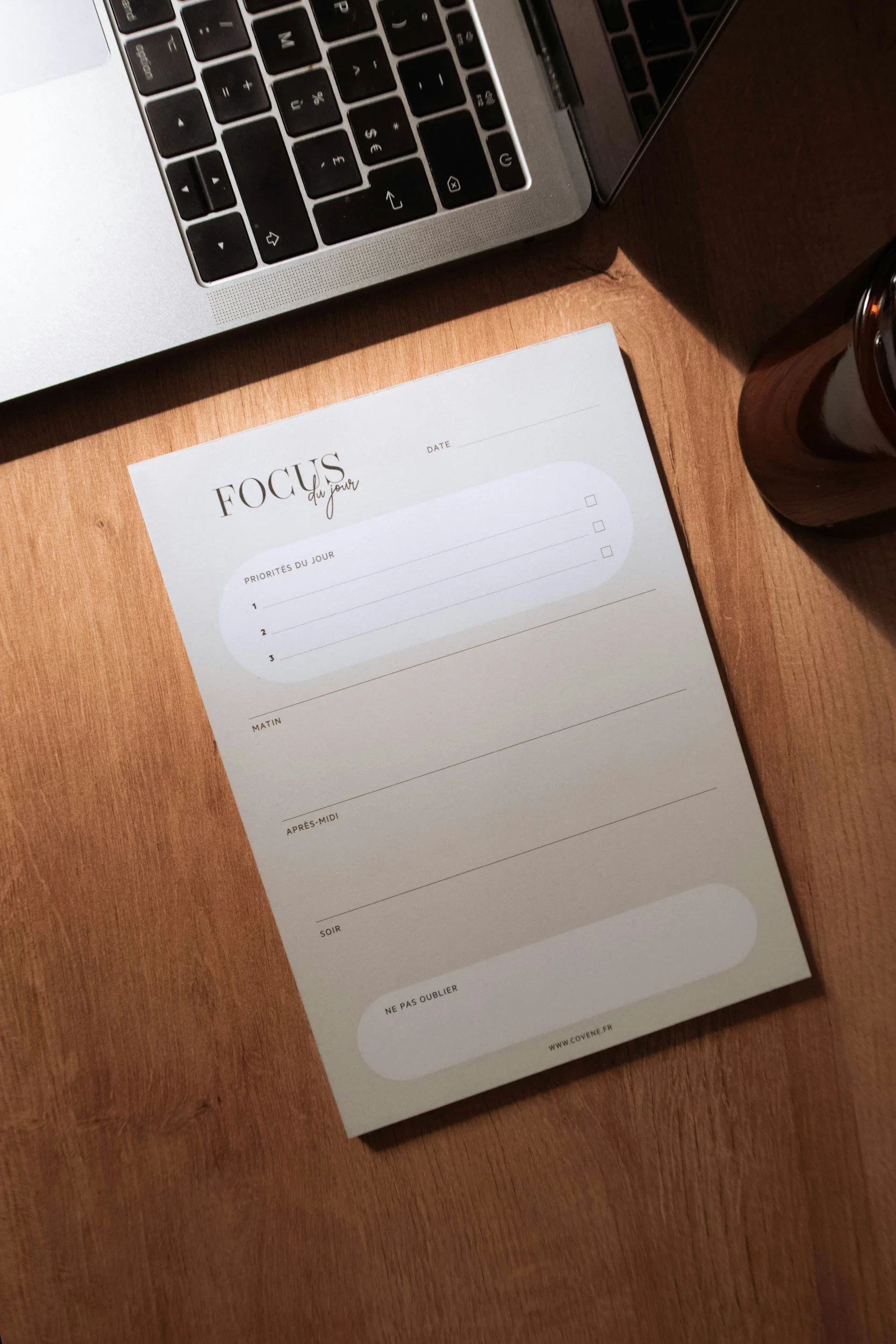 Realistic daily checklist for work-from-home moms on a desk