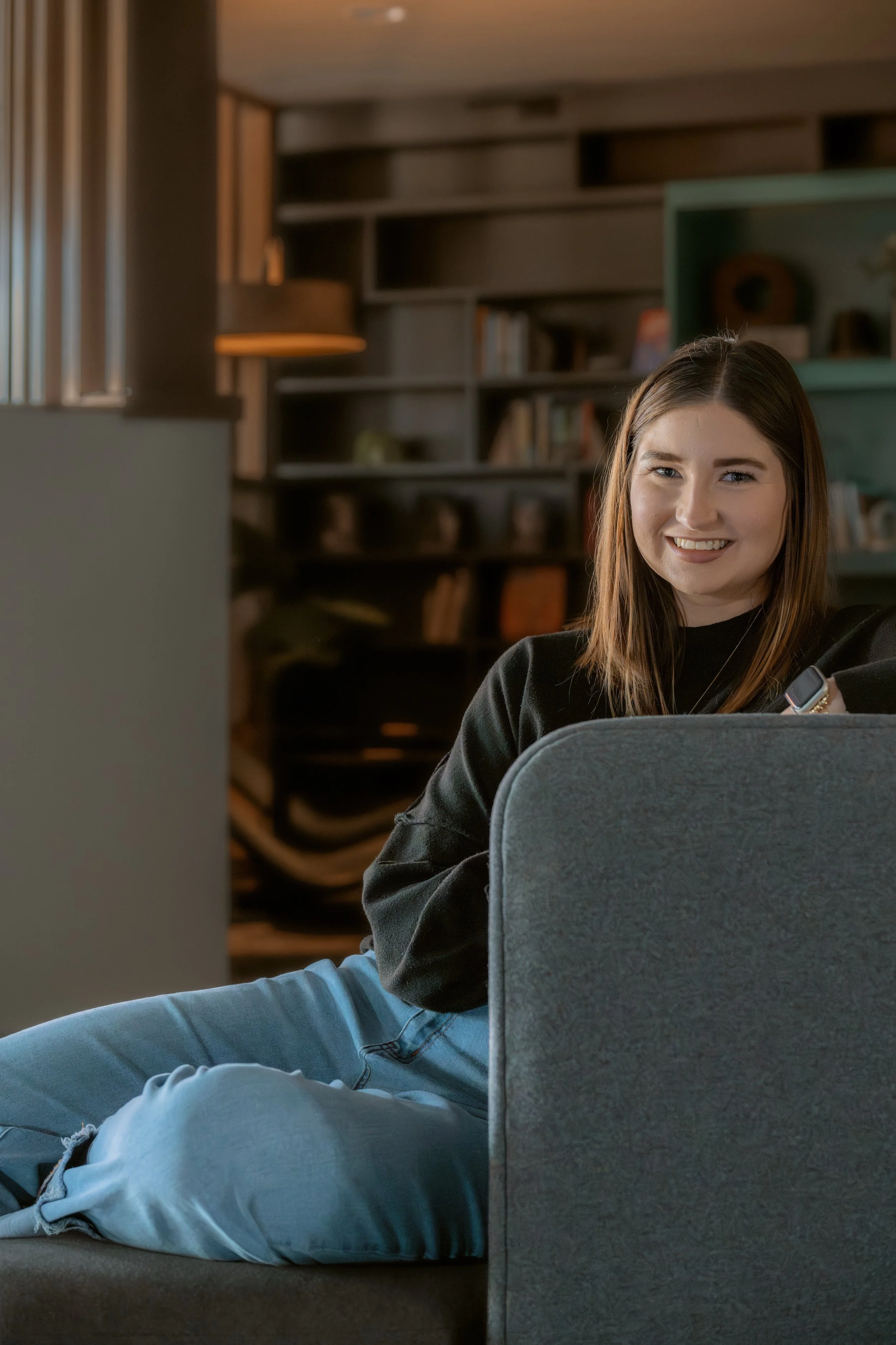 Savannah, founder of Thrive at Home with Sav, sitting in a home workspace