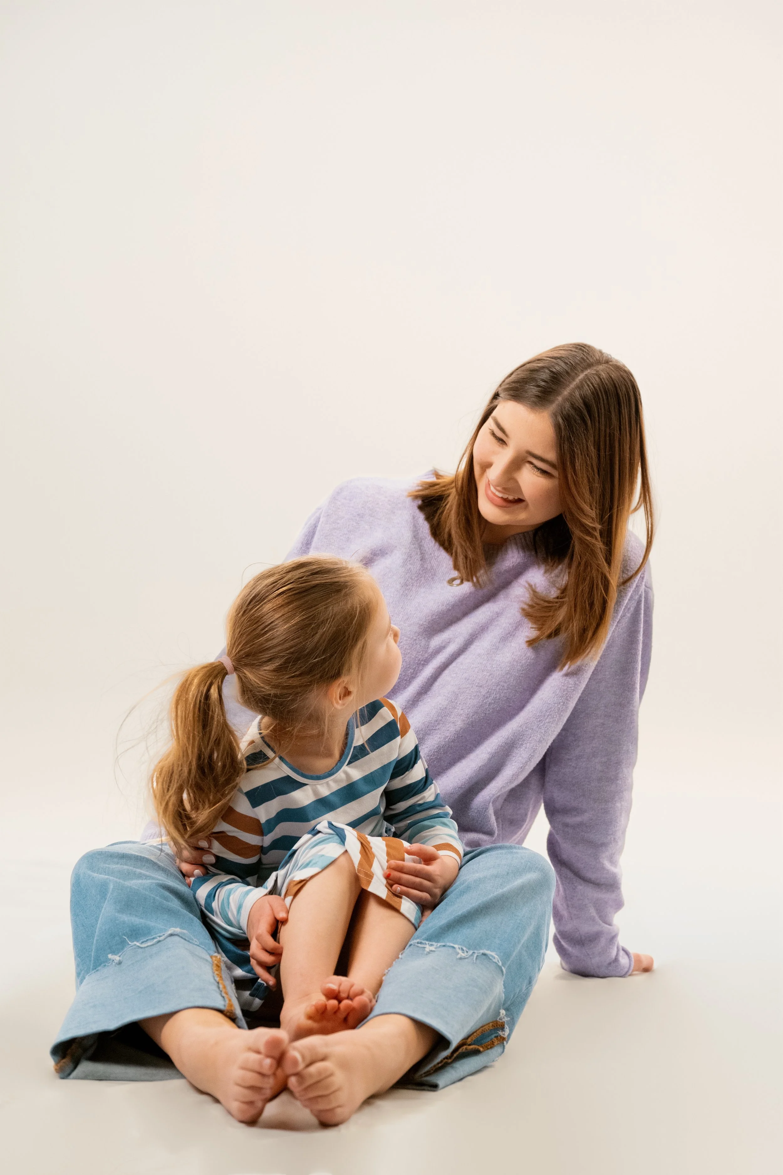 Mother and daughter spending time together at home during the workday