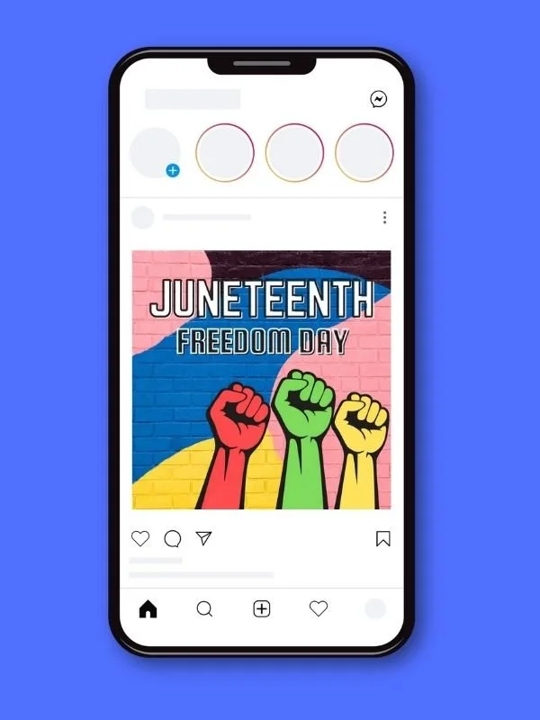 A smartphone displaying an Instagram post celebrating Juneteenth with a background of a pink brick wall and a flag showing the colors blue, yellow, and pink. The post features three raised fists in red, green, and yellow, and the text "Juneteenth Freedom Day".