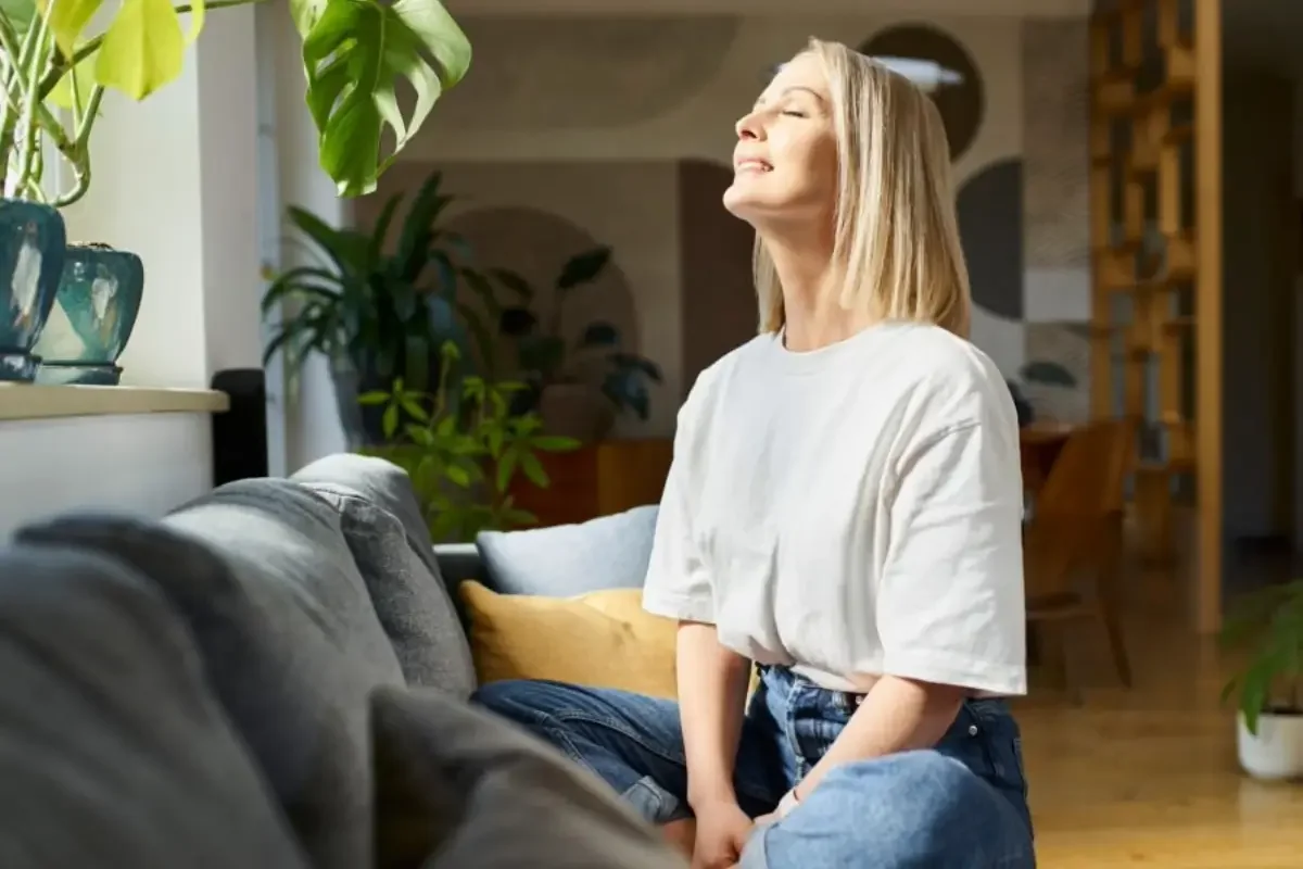 Person looking peaceful and comfortable after practicing relaxation techniques