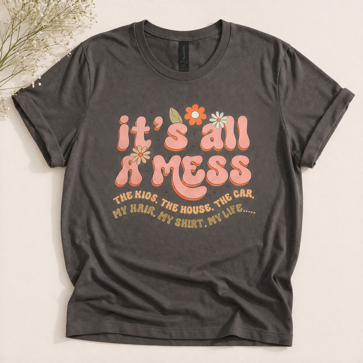 70s-inspired graphic t-shirt flat lay.png