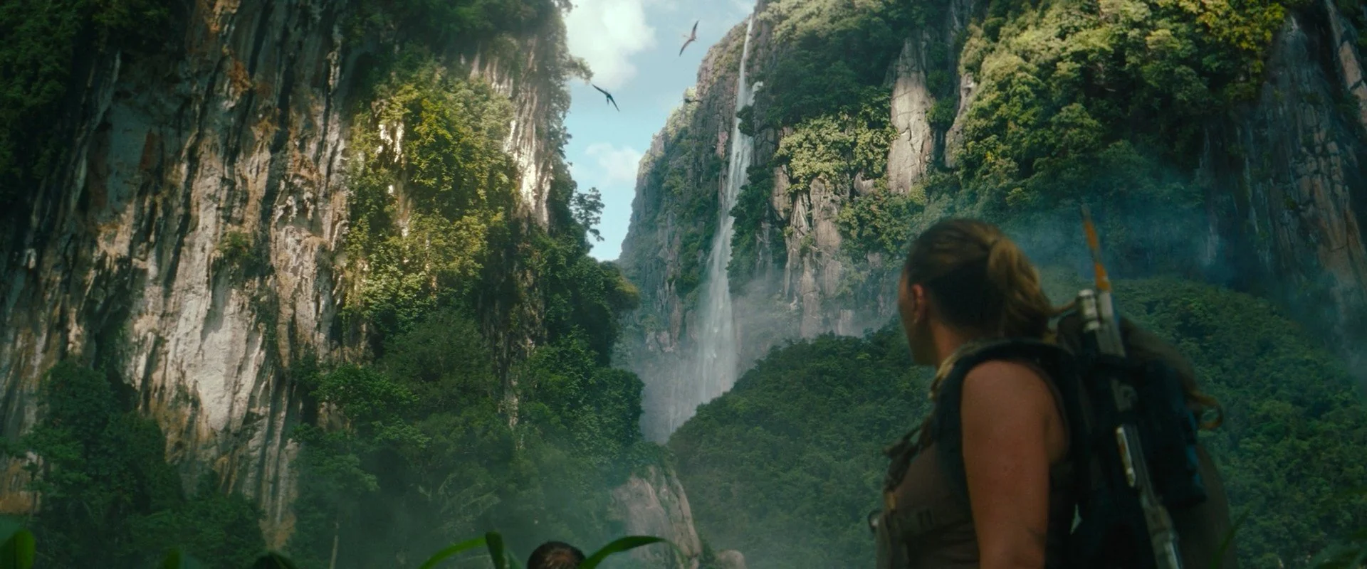 One of the first shots on the film we worked on. This is 3d in the foreground to create the gap where they are going, and then projections and matte painting for the cliffs and waterfalls. 