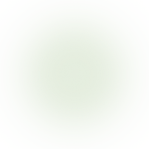 Very light beige background with faint greenish hue, no discernible objects or details.