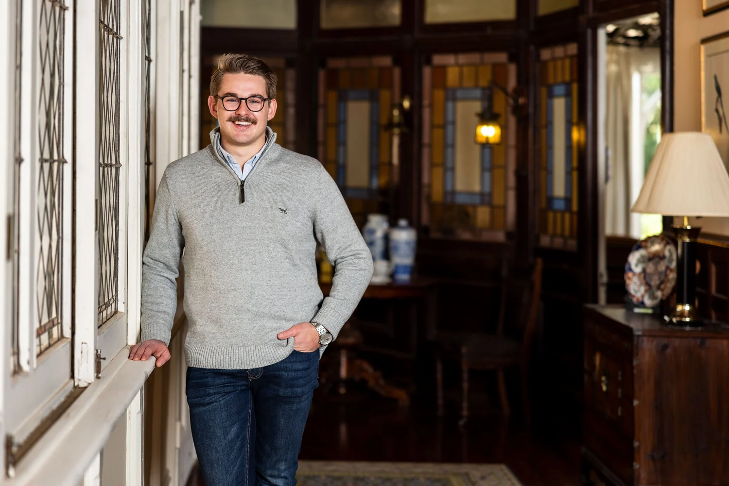 Retail business owner portrait with wine and laptop
