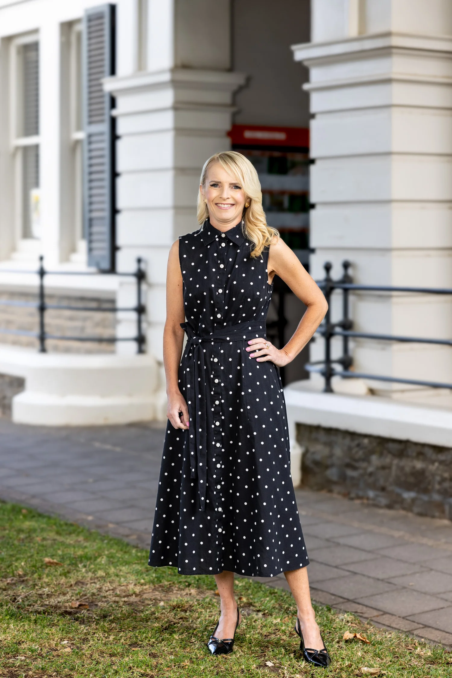 Business portrait of a woman outside a heritage building