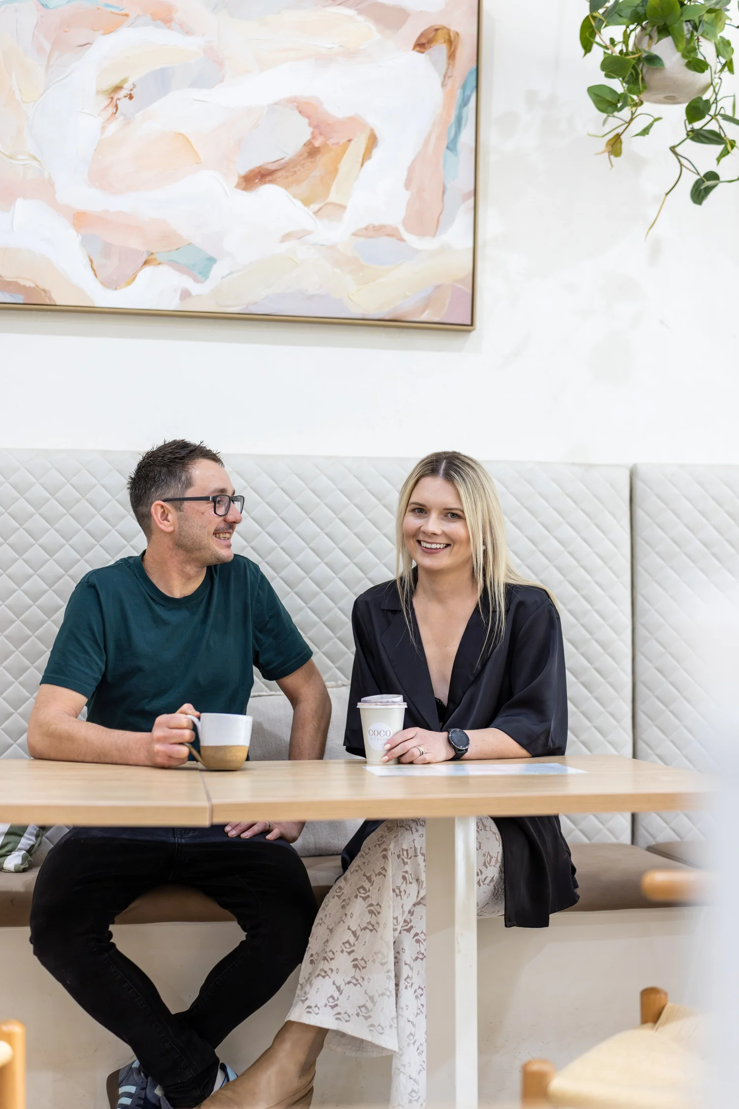Lifestyle portrait of two business owners in a cafe