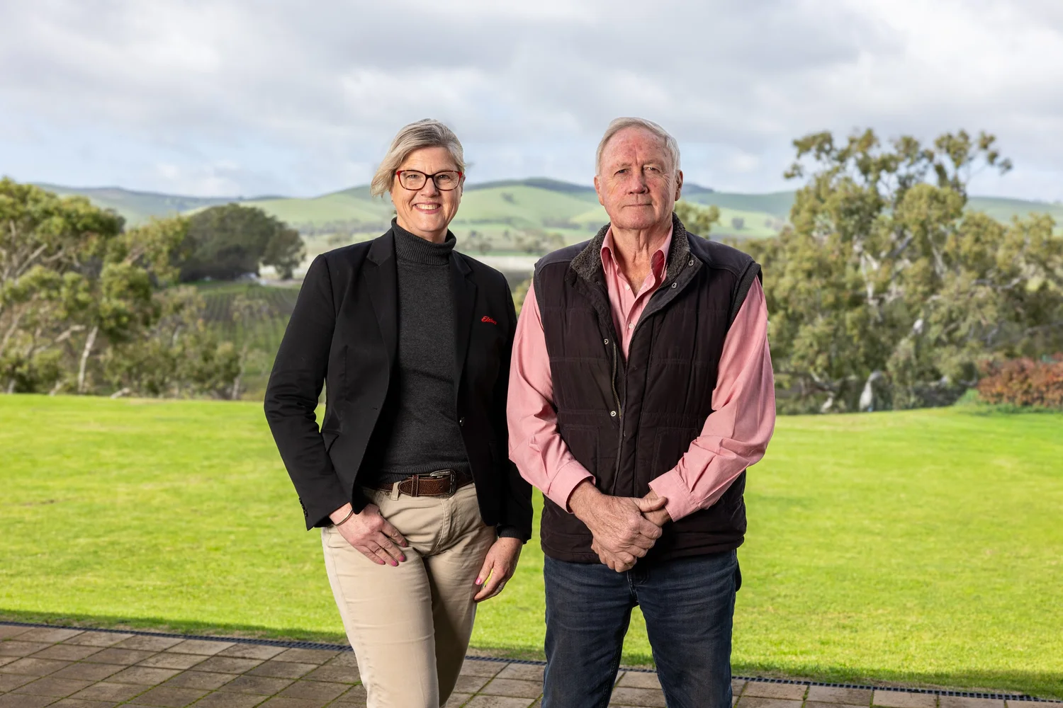 Two person business portrait overlooking Barossa hills and vineyards