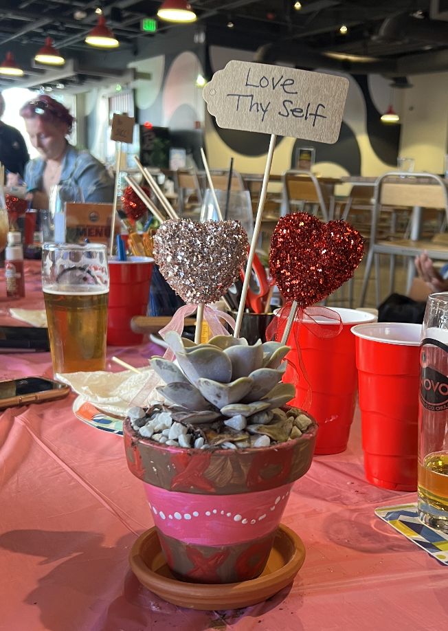 painted ceramic pot with succulent and dcorations