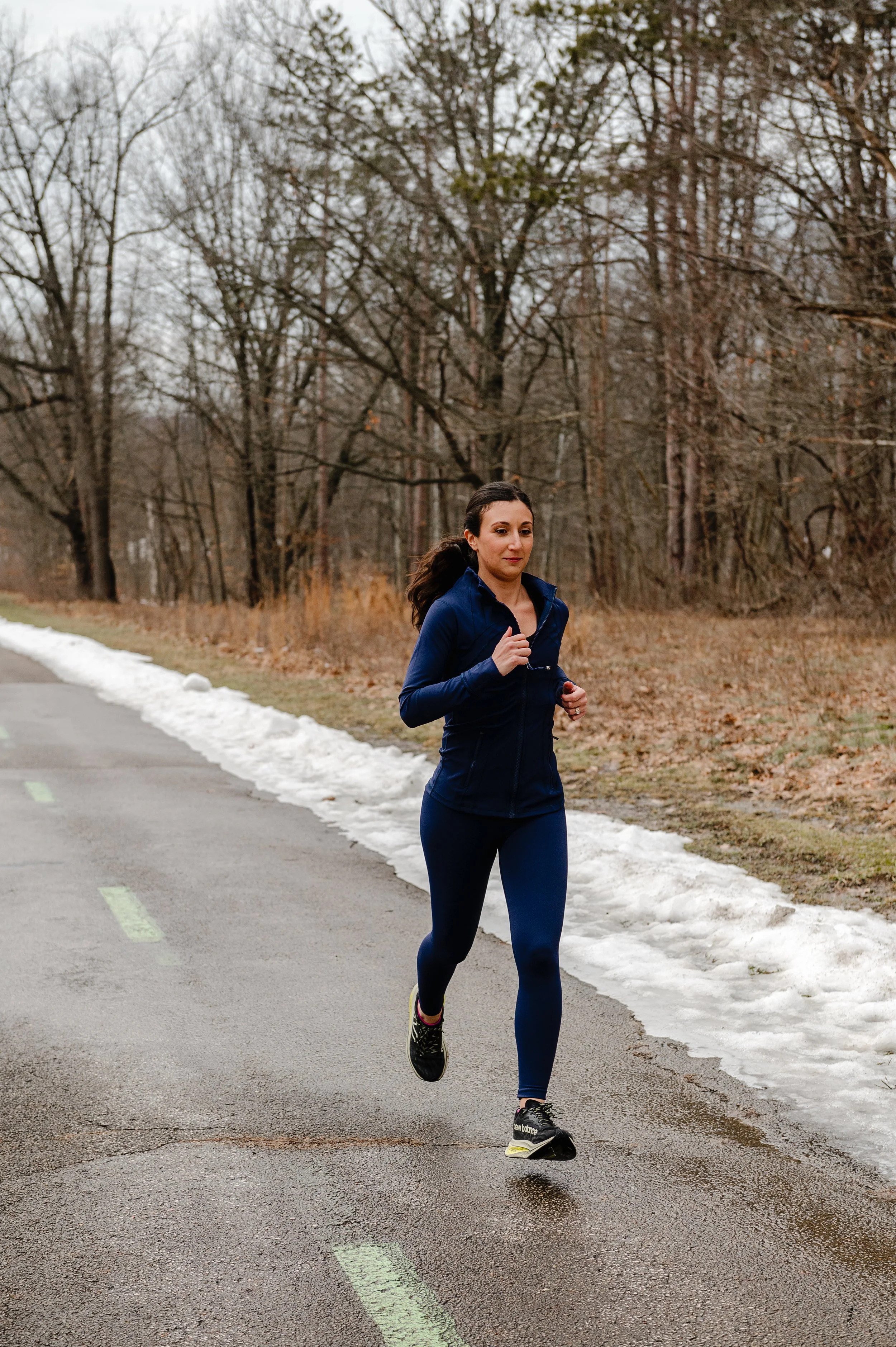 Dr. Joanna Consiglio, chiropractor and acupuncturist in North Royalton, running outdoors—highlighting her active lifestyle and commitment to athlete-focused functional medicine care.