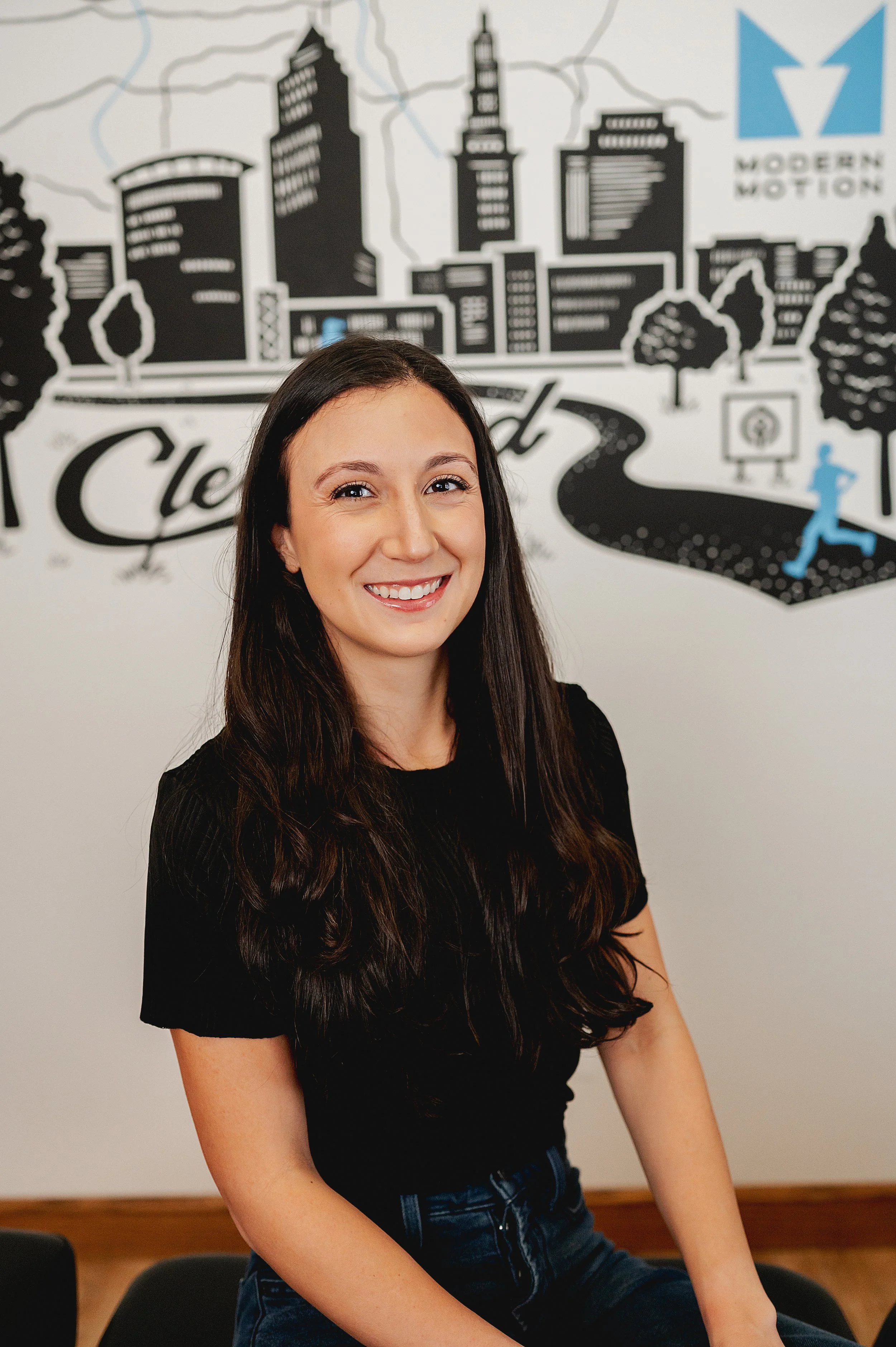 Professional headshot of Dr. Joanna Consiglio, chiropractic physician and acupuncturist at Modern Motion Chiropractic in North Royalton, dedicated to personalized, evidence-based care for active individuals.