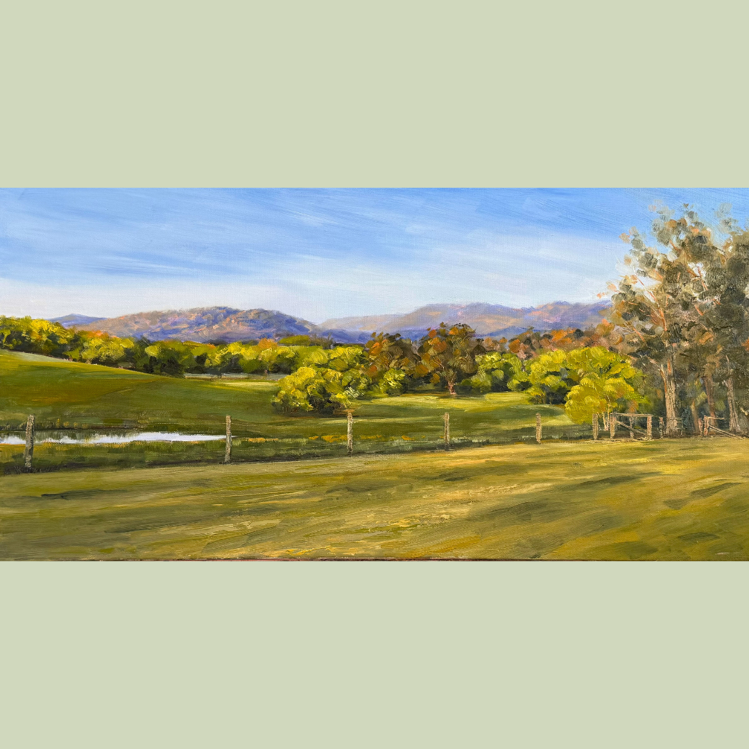 A scenic landscape painting of rolling green hills, a fence, trees, a pond, and mountains in the background under a blue sky.
