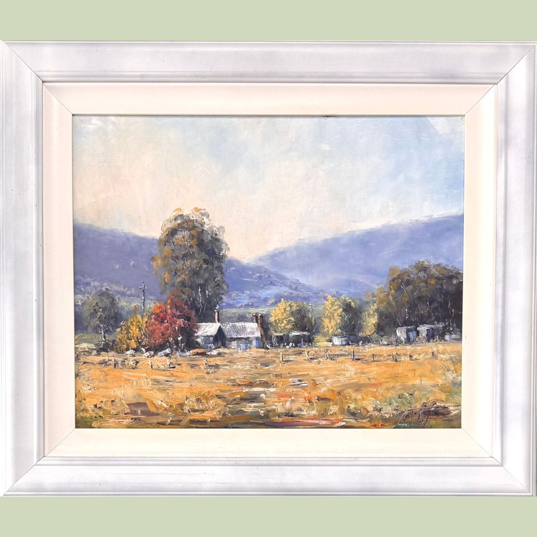 A landscape painting of a rural scene with a large tree, small houses, and distant mountains under a light sky.