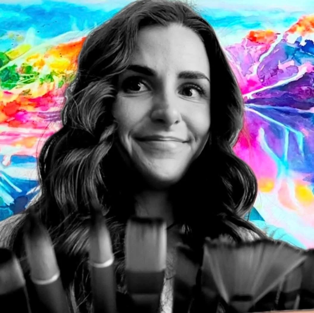 A black and white portrait of a smiling woman with long wavy hair, with a vibrant, colorful abstract background.