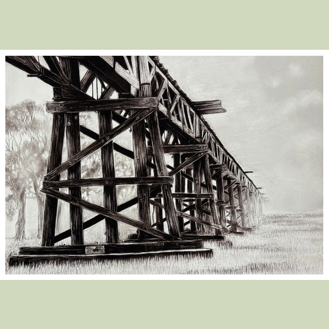A black and white drawing of a wooden dock extending over a river, with trees and foliage in the background.
