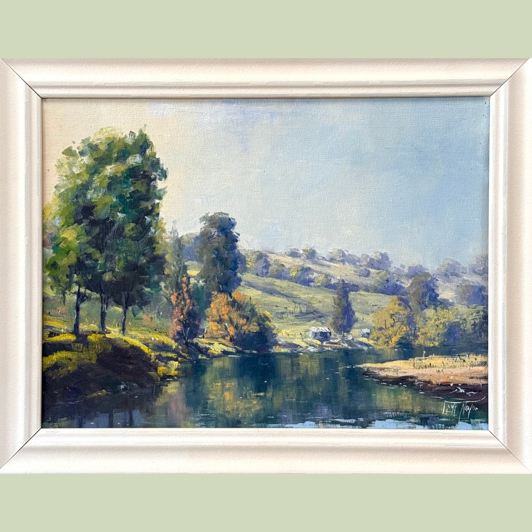 Landscape painting of a river with lush trees on the bank, rolling hills in the background, and a partly cloudy sky.