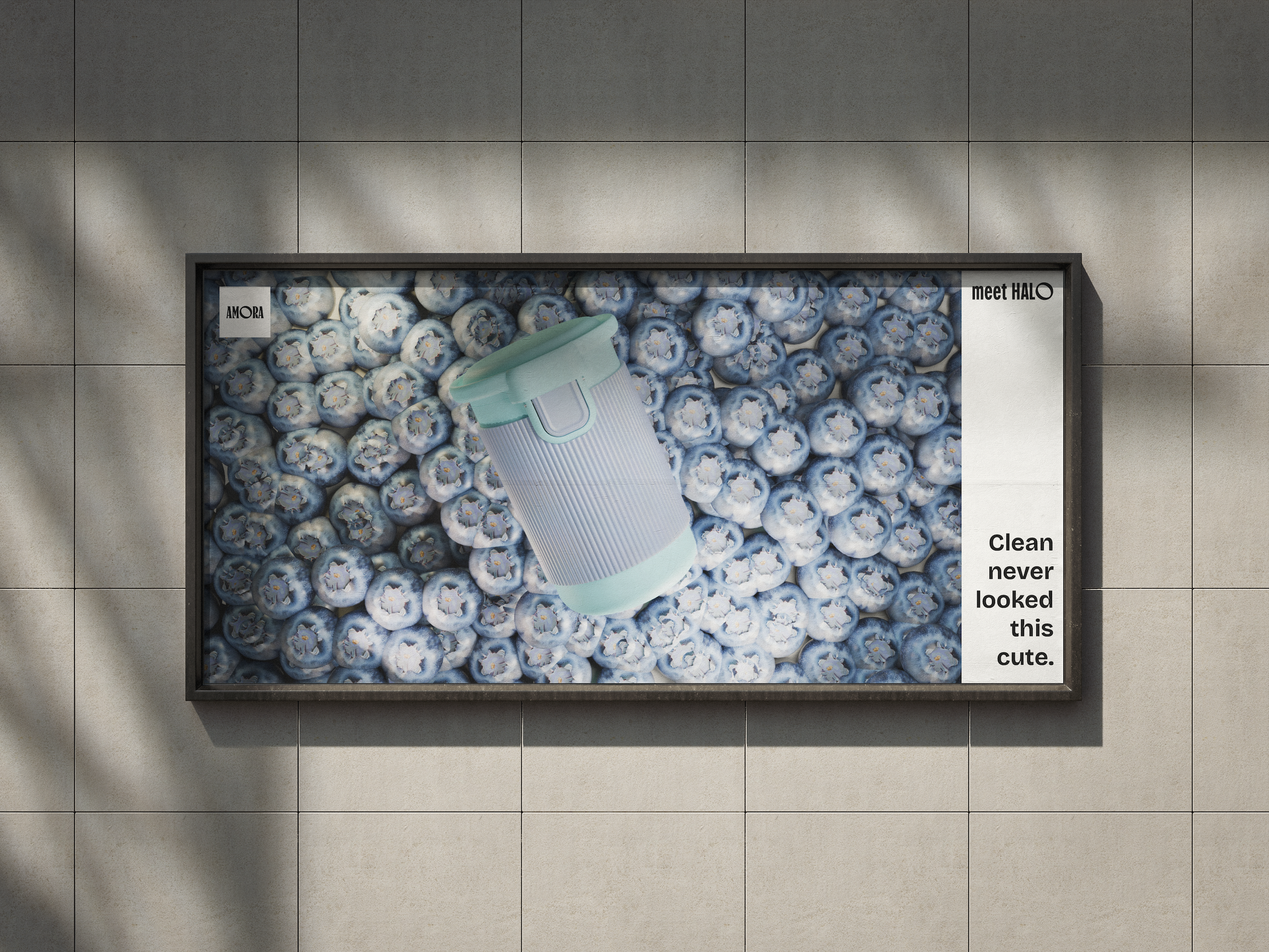 Outdoor billboard featuring Halo in the Blueberry Mochi colourway displayed over a bed of blueberries, with the text “Clean never looked this cute” and the brand labels “AMORA” and “meet HALO.”