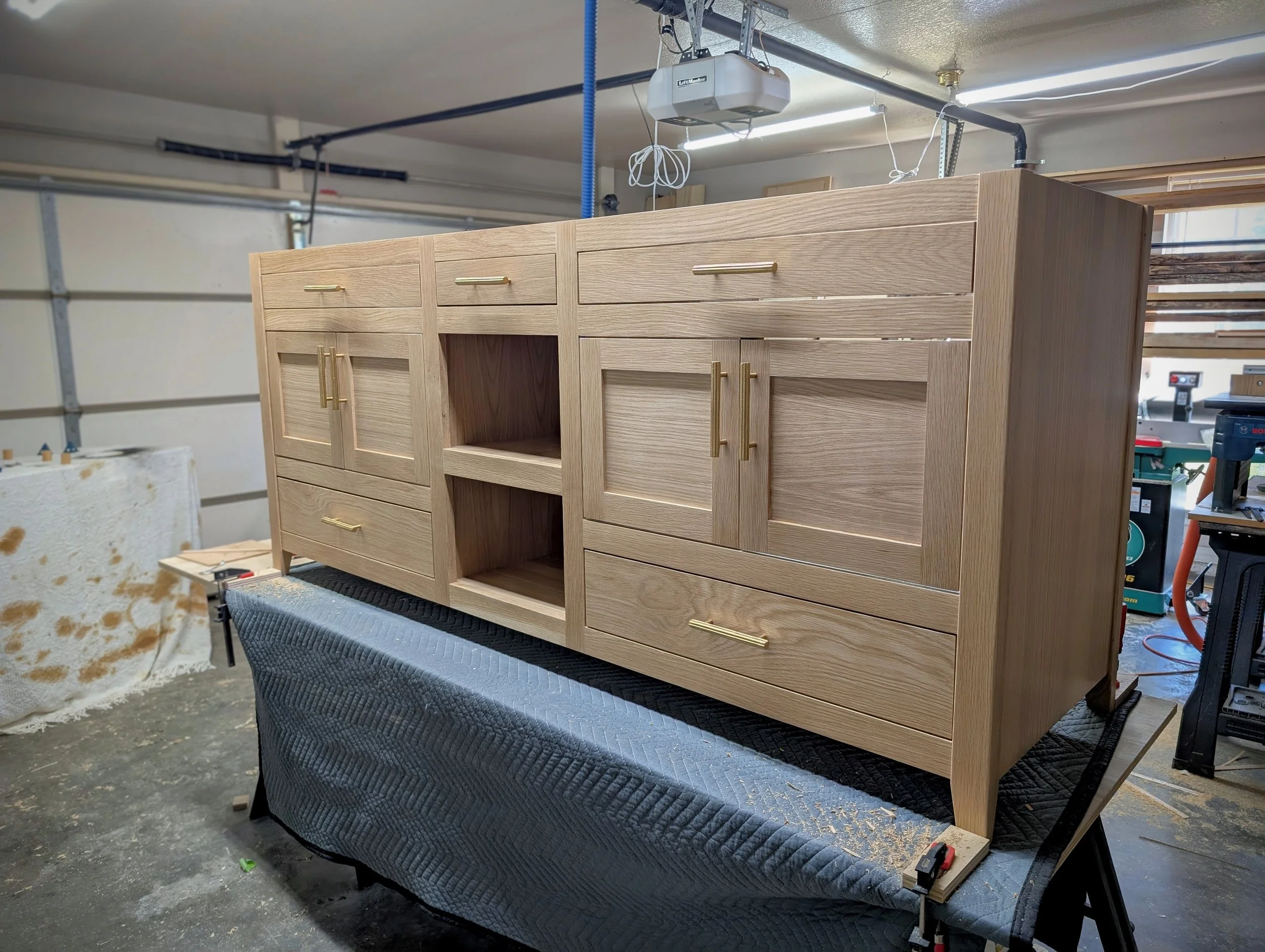 White Oak bathroom vanity with gold pulls