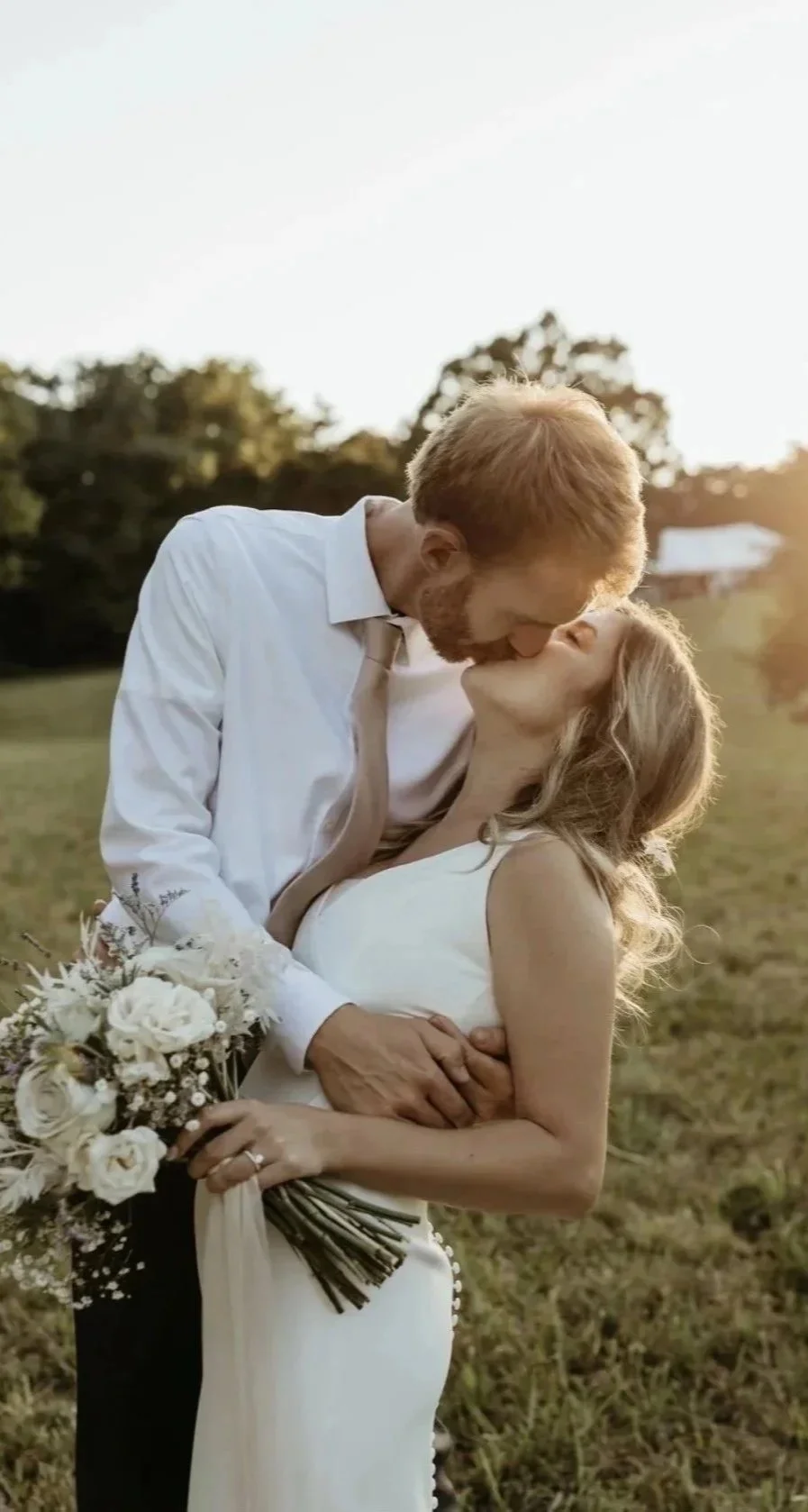 Sunset picture of newly married couple in field. Outdoor, scenic, garden wedding near Charlotte, NC